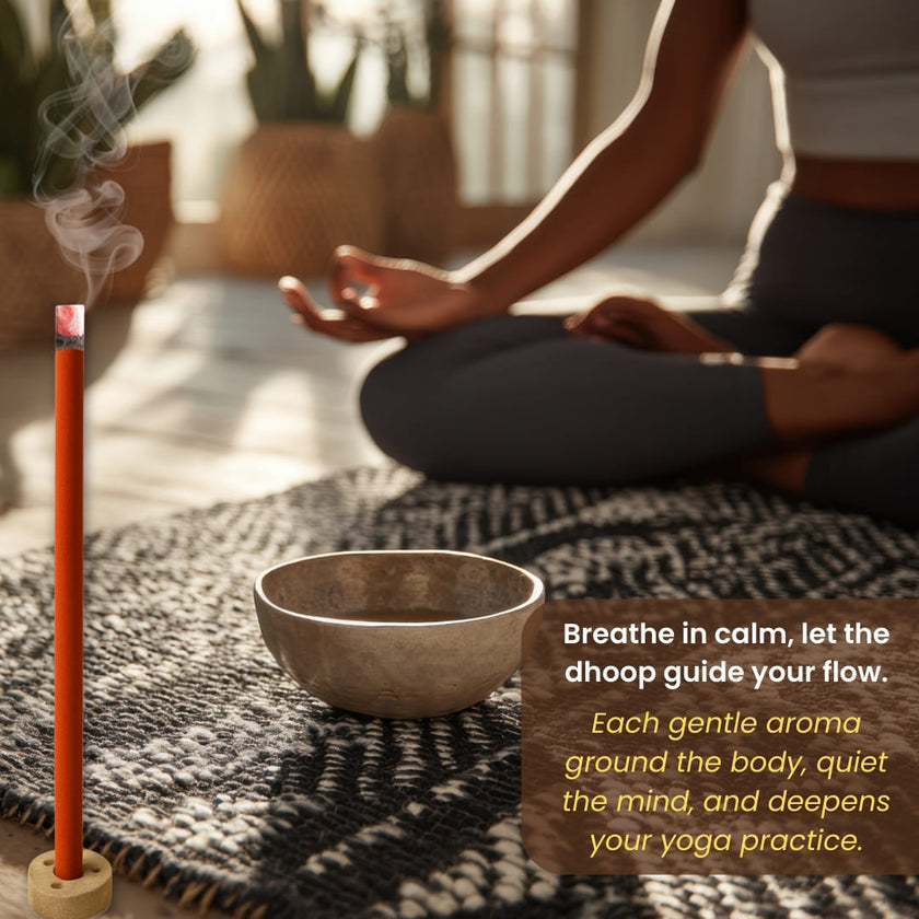 Incense stick burning beside a singing bowl and woman meditating in a peaceful yoga setting.