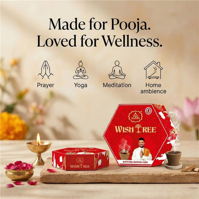 Red Wish Tree matti pal incense cups packaging on table with lit diya, flower petals, and incense smoke, ideal for prayer, yoga, meditation, and home ambience.