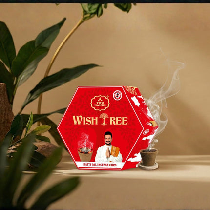 Wishtree Sambrani cup box with incense cup emitting fragrant smoke on a neutral background