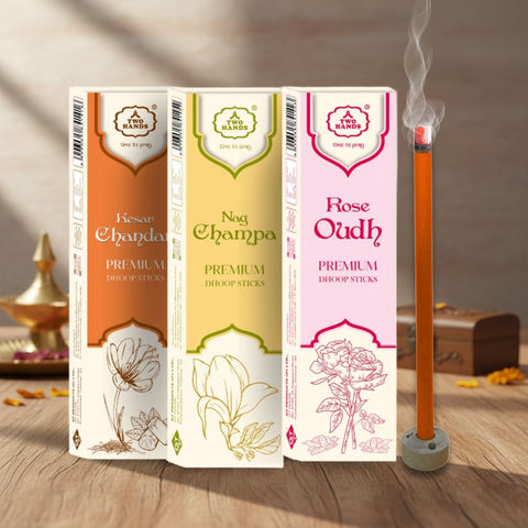 Assorted premium dhoop sticks in Kesar Chandan, Nag Champa, and Rose Oudh scents on wooden table